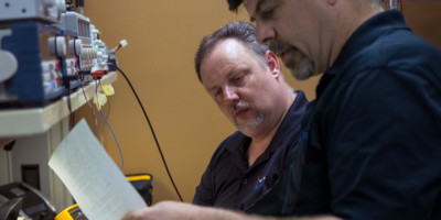 TSS team members reading instructions