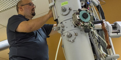 TSS team member adjusting a scope