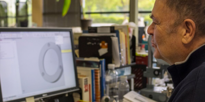 TSS team member reviewing data from a scope