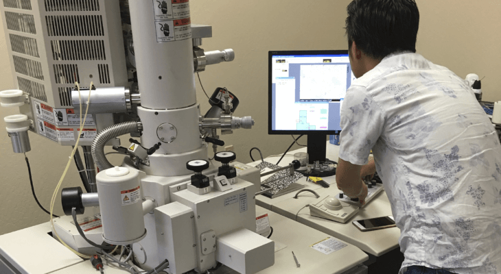 TSS team member taking in results on a computer